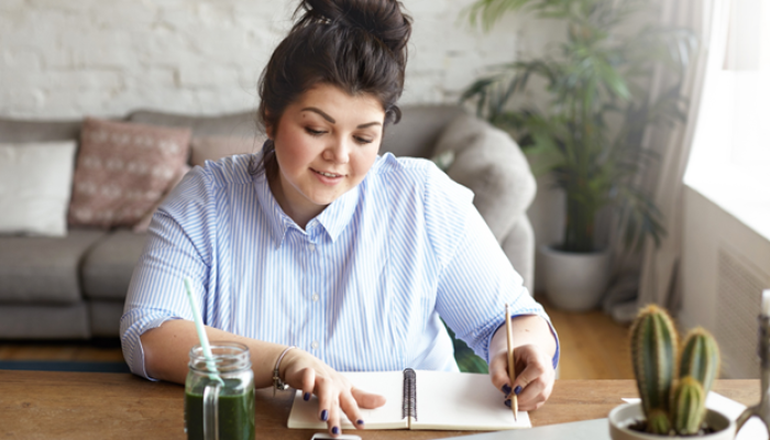 Lady on her desk reviewing her budgets